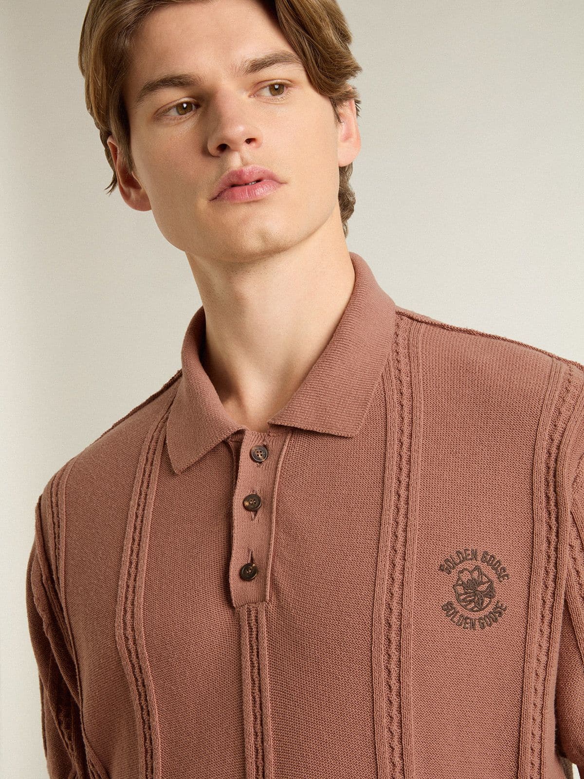 Men's brick-colored polo with embroidered logo.