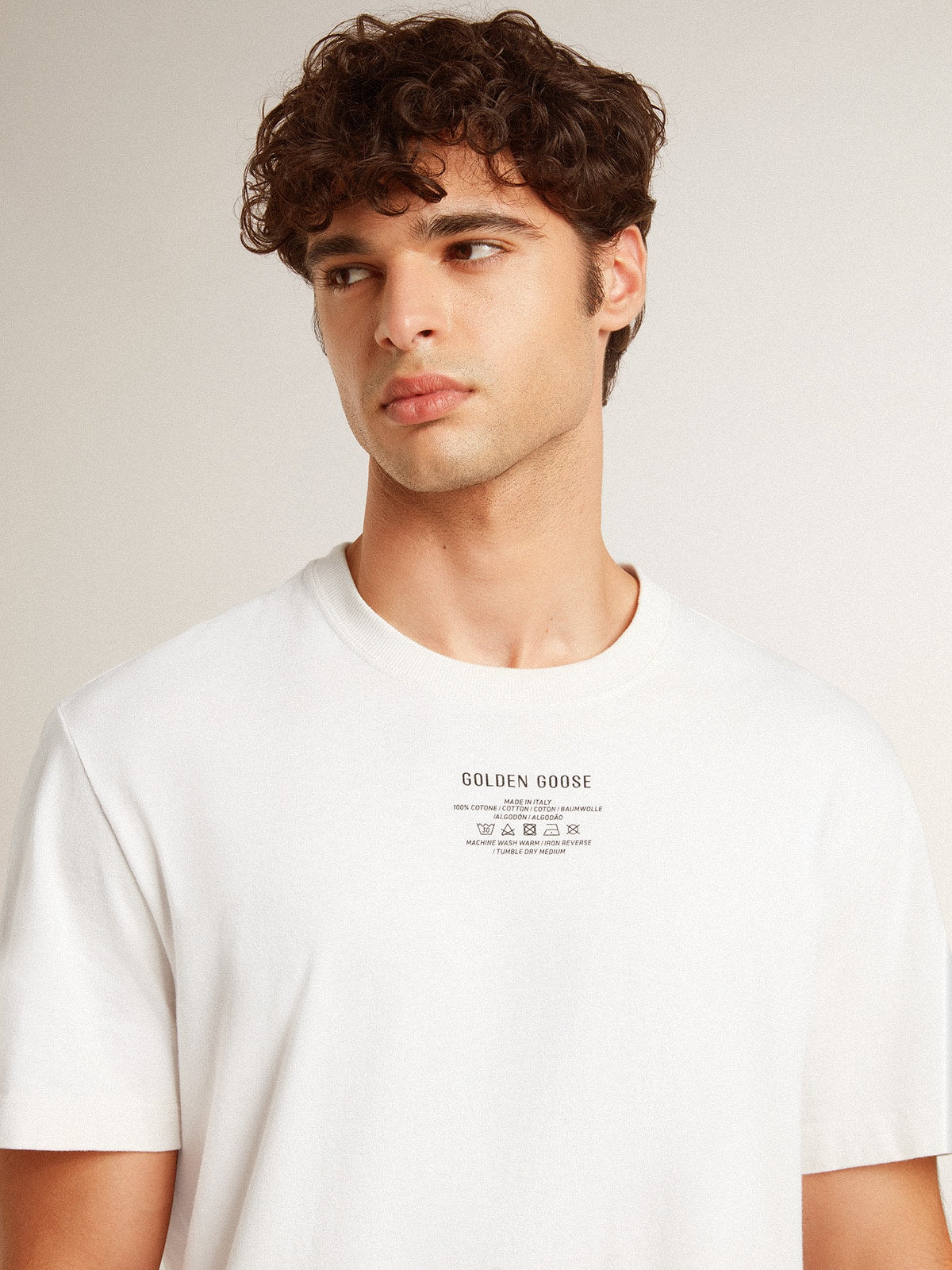 Men's worn-white cotton T-shirt with black lettering