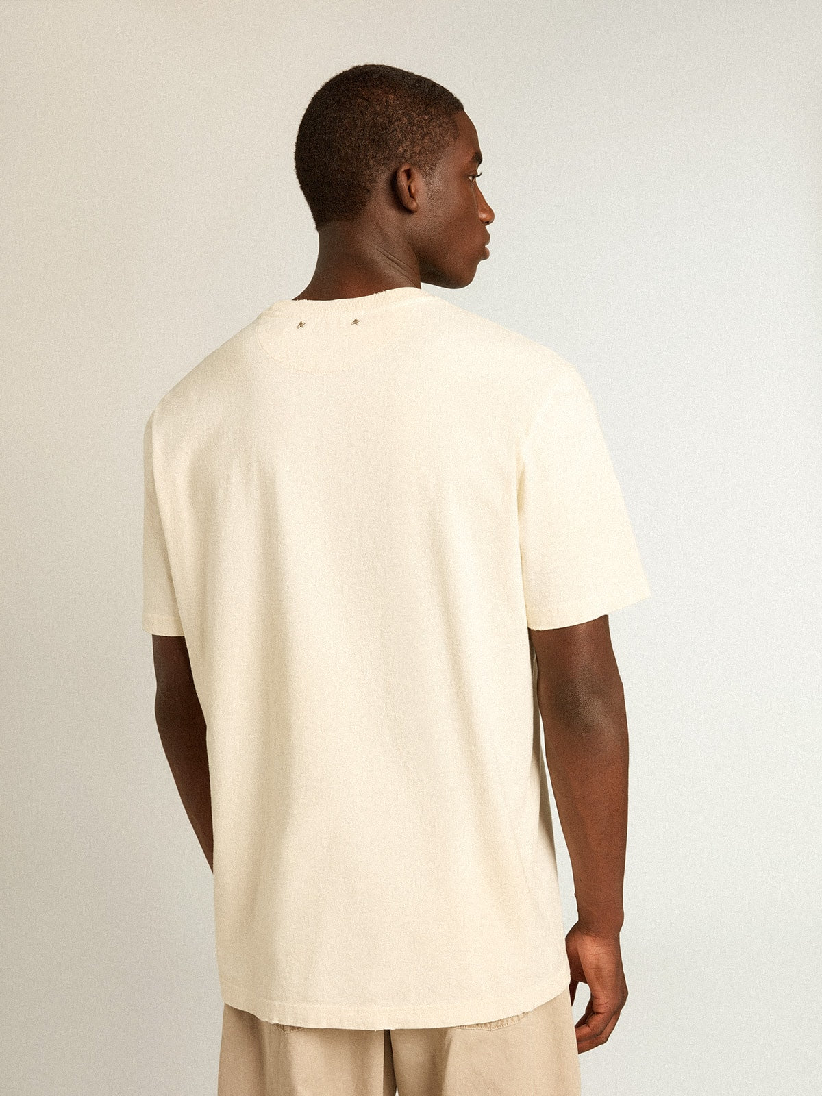 Men’s aged white cotton T-shirt with print on the front