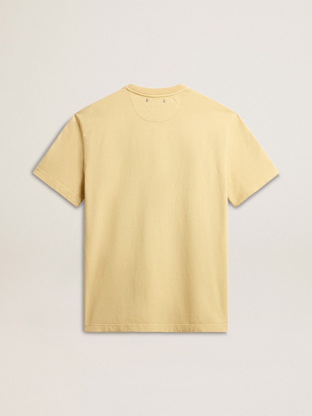 Men's cotton T-shirt in pale yellow with faded lettering