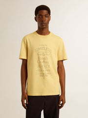 Men's cotton T-shirt in pale yellow with faded lettering