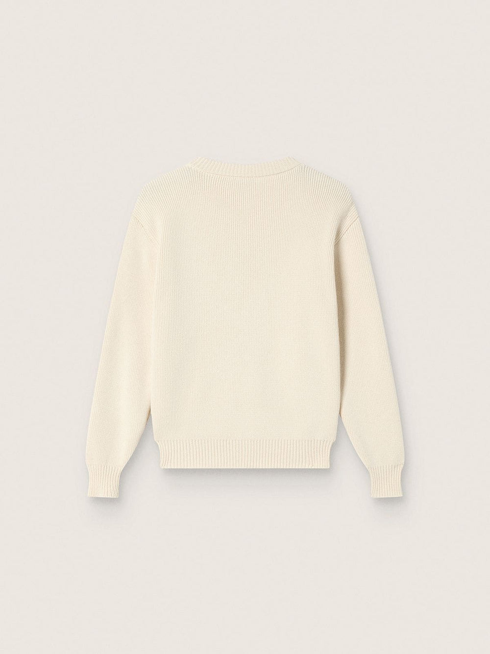 Golden girls’ sweater in white cotton yarn with mascot embroidery