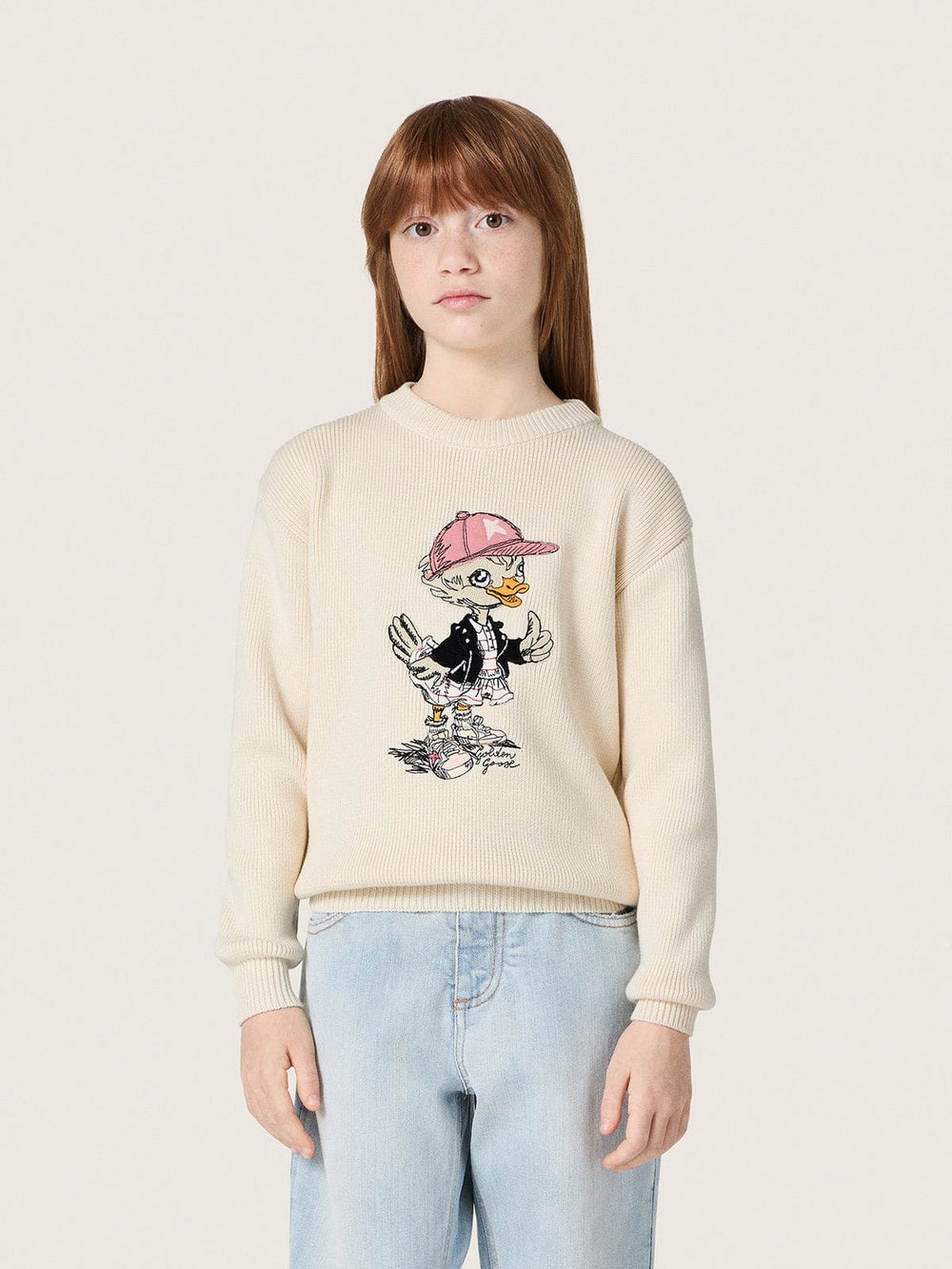 Golden girls’ sweater in white cotton yarn with mascot embroidery