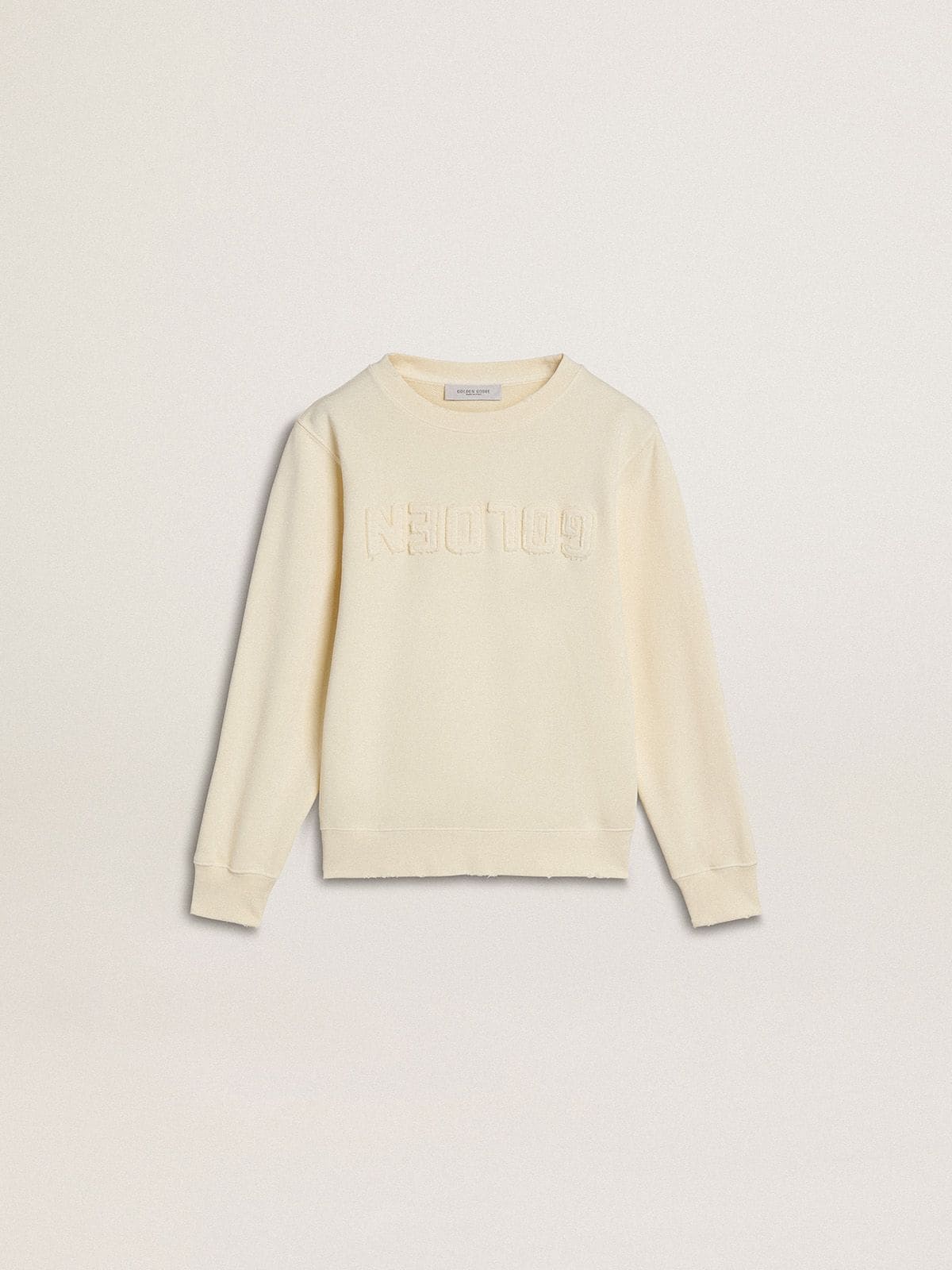 Girls’ cream-colored sweatshirt with patch writing