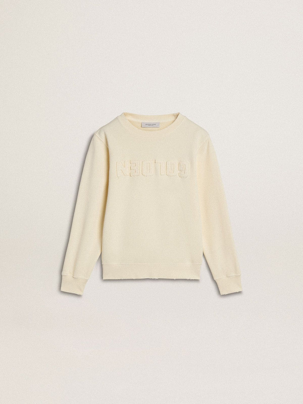 Girls’ cream-colored sweatshirt with patch writing