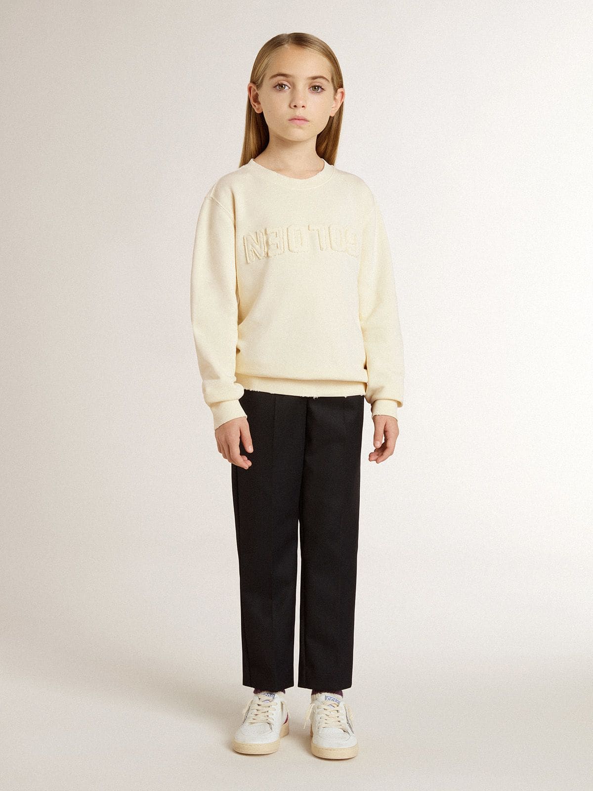 Girls’ cream-colored sweatshirt with patch writing