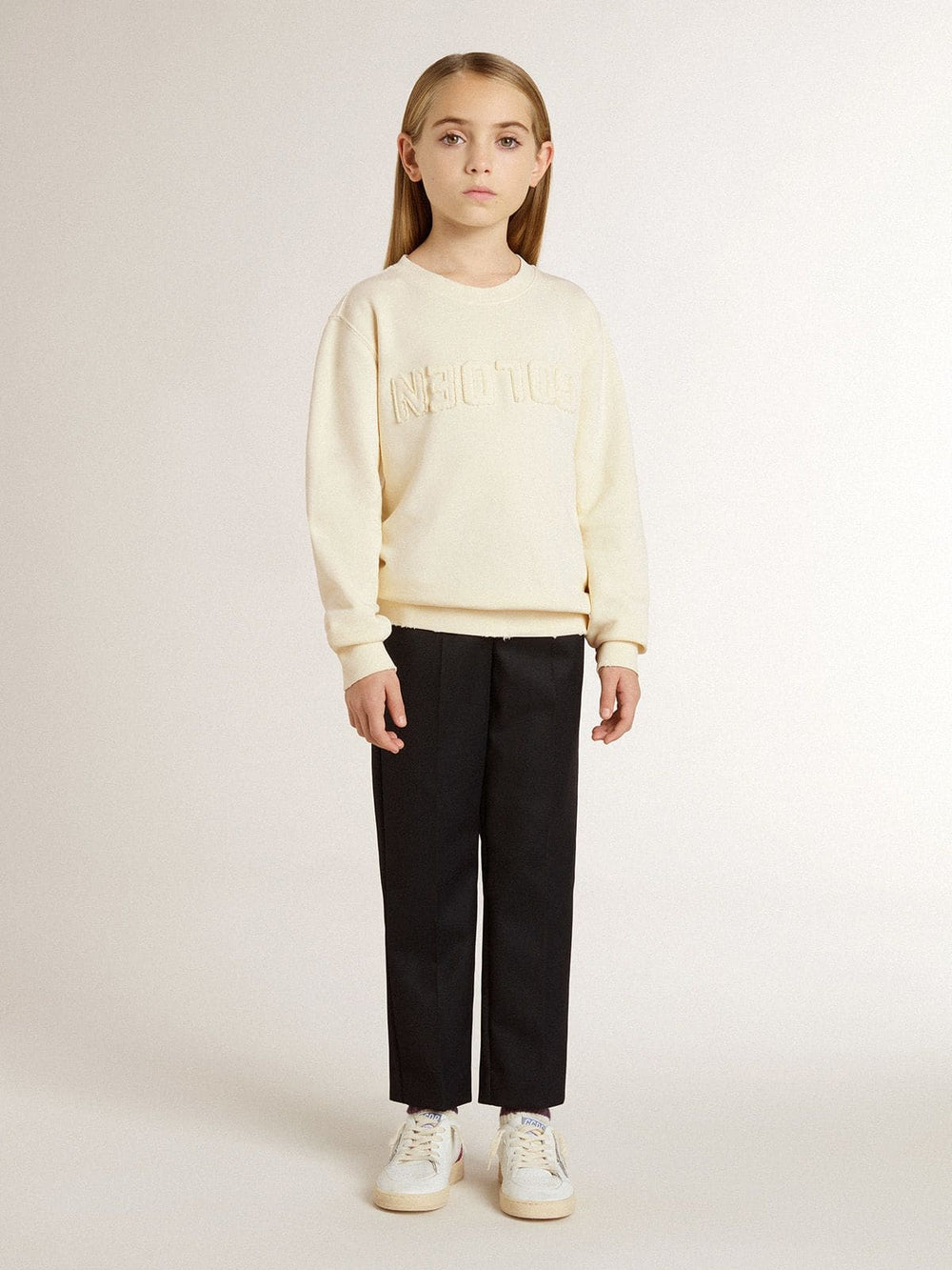 Girls’ cream-colored sweatshirt with patch writing