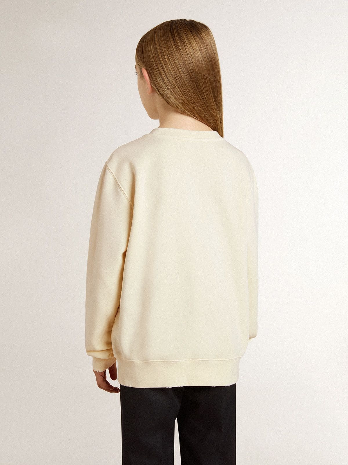 Girls’ cream-colored sweatshirt with patch writing