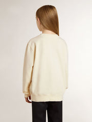 Girls’ cream-colored sweatshirt with patch writing