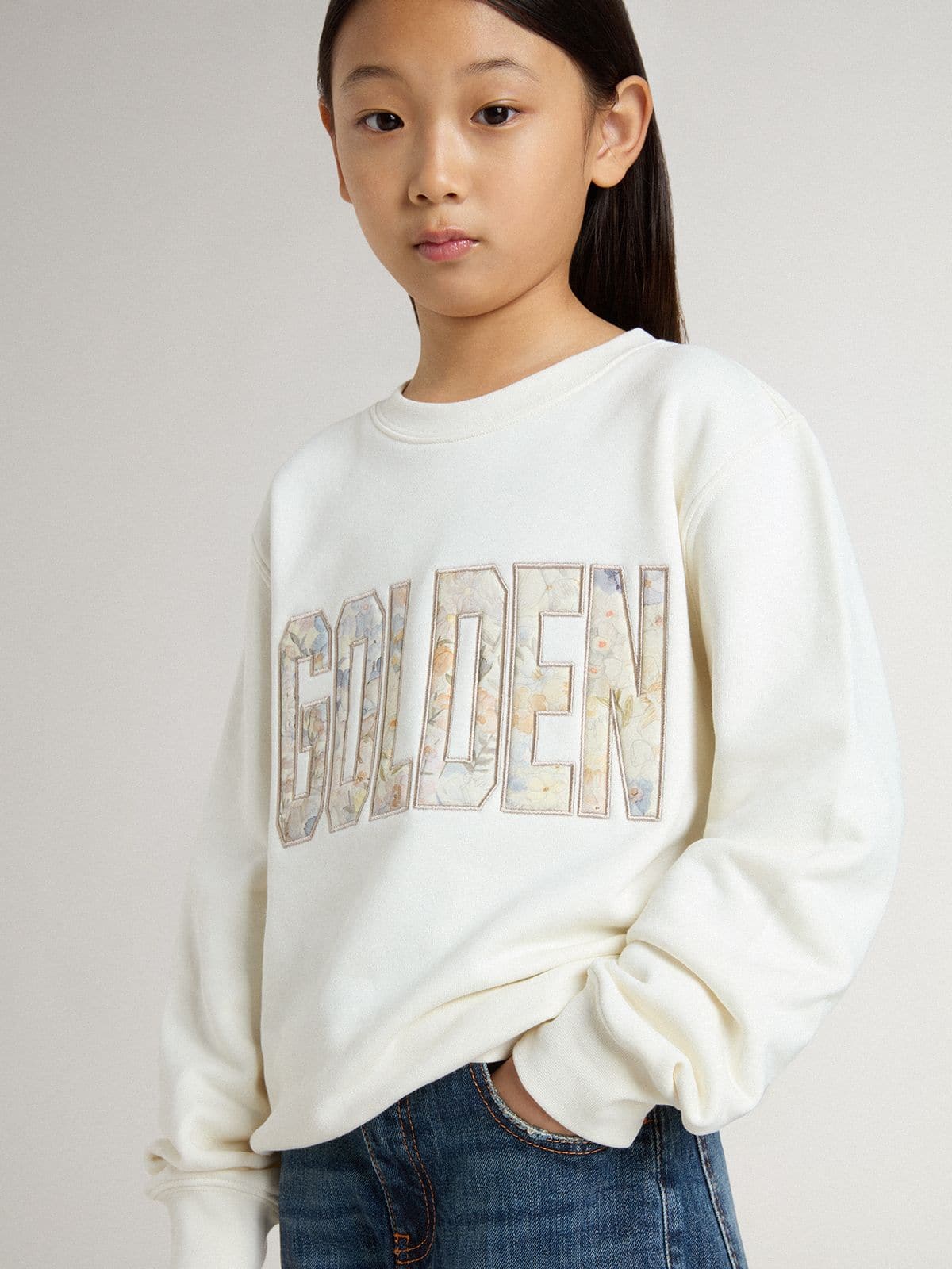 Girls' white sweatshirt with multicolor Golden writing on the front