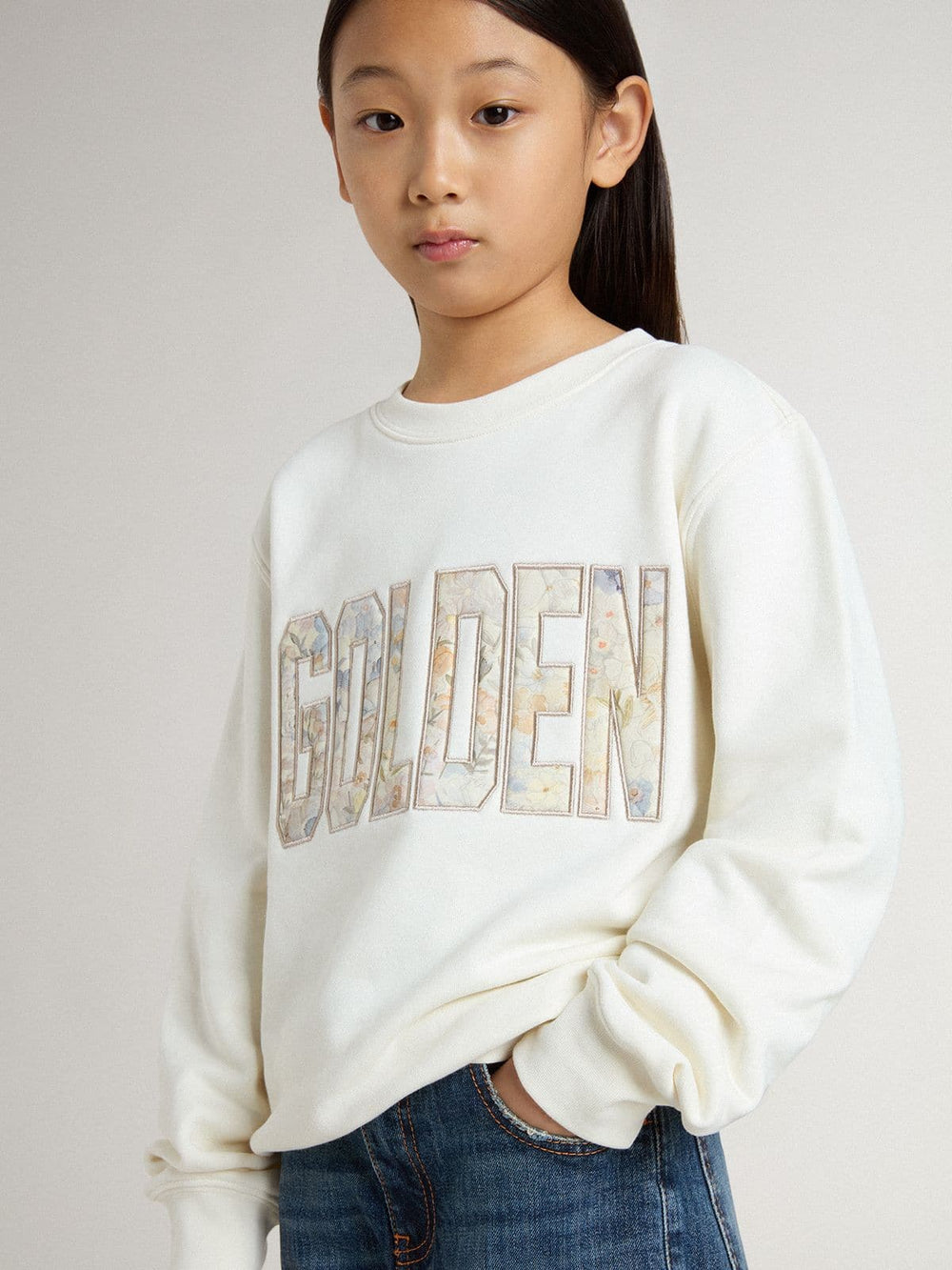 Girls' white sweatshirt with multicolor Golden writing on the front