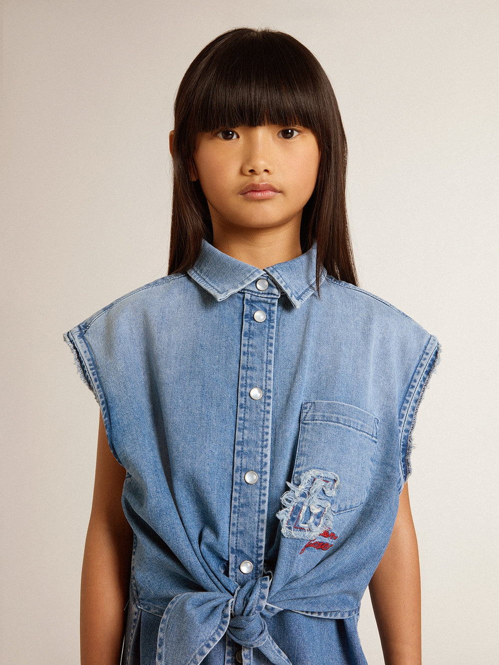 Girls' denim dress with front knot and embroidery