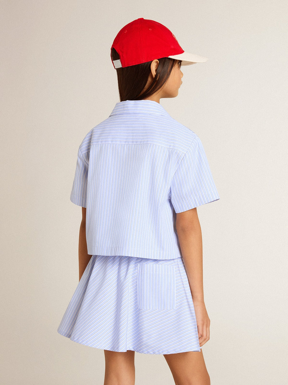 Girls' cropped shirt in striped light blue cotton