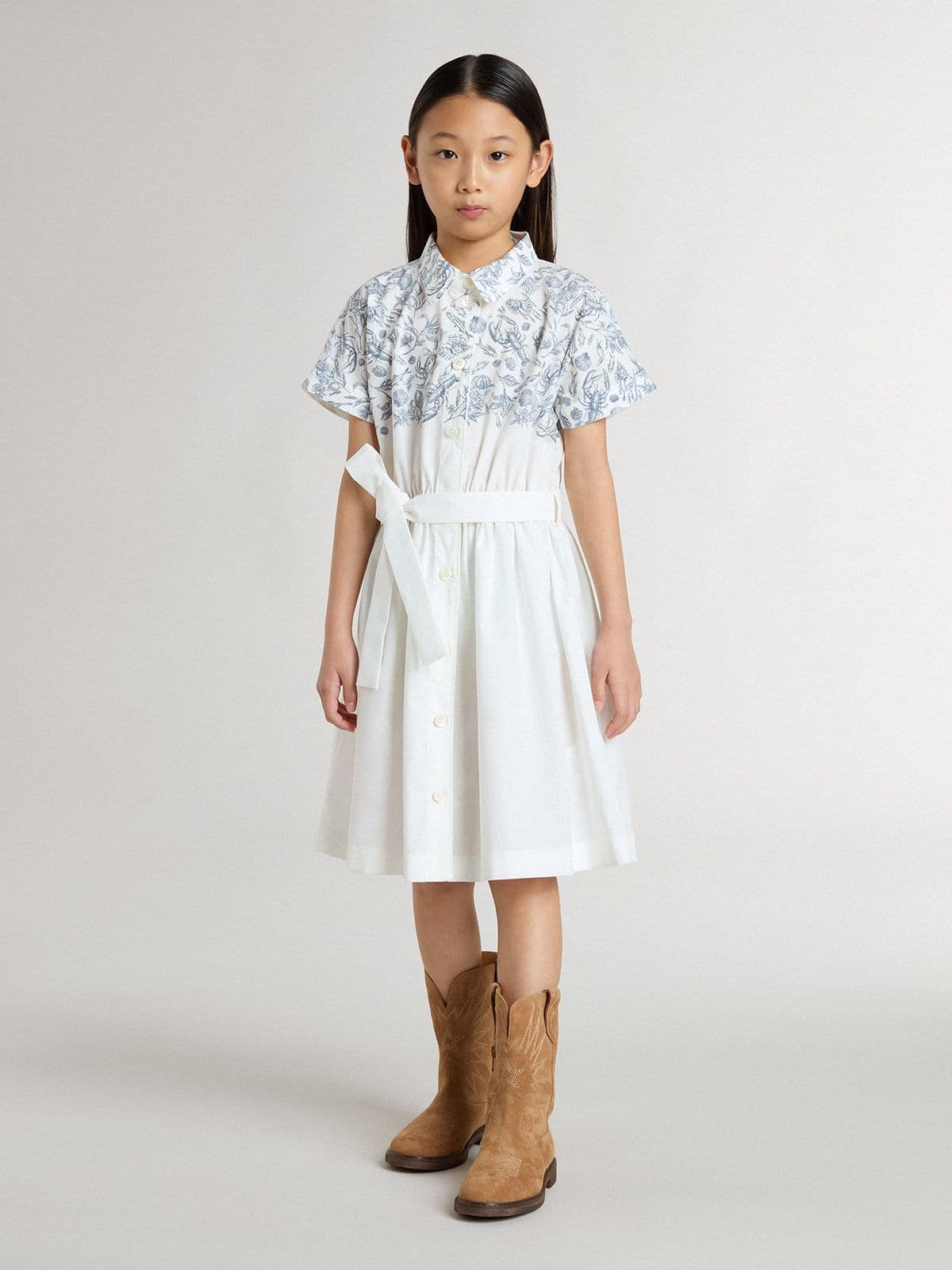 Girls’ shirt dress in white cotton canvas with a blue nautical print and white piping