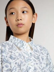 Girls’ shirt dress in white cotton canvas with a blue nautical print and white piping