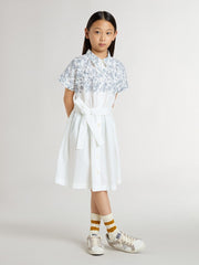 Girls’ shirt dress in white cotton canvas with a blue nautical print and white piping