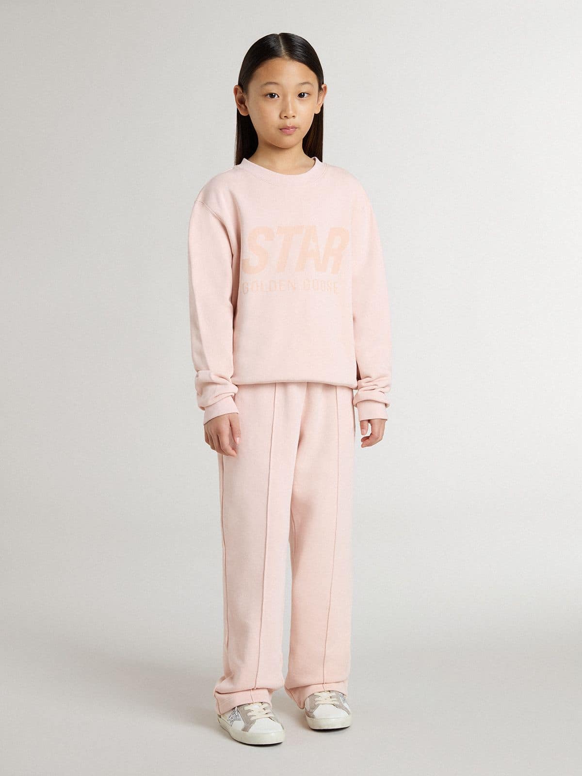 Girls' pink-colored sweatshirt with pink front lettering