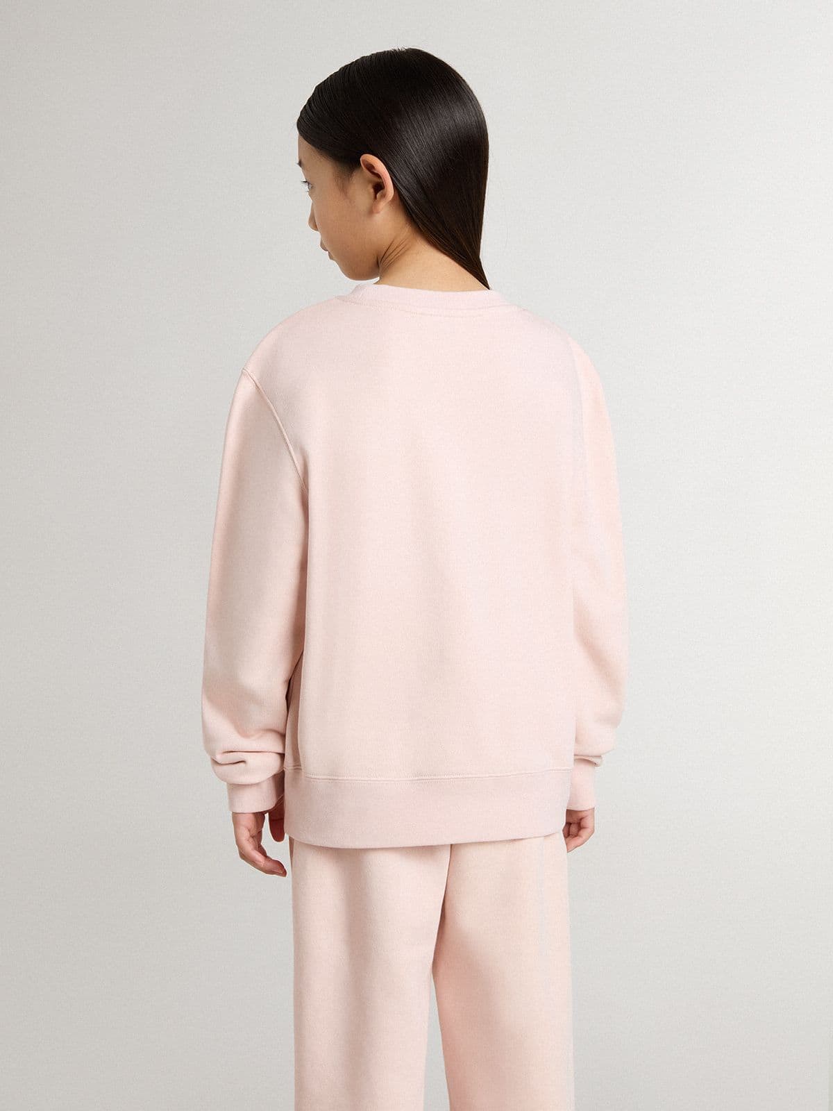 Girls' pink-colored sweatshirt with pink front lettering