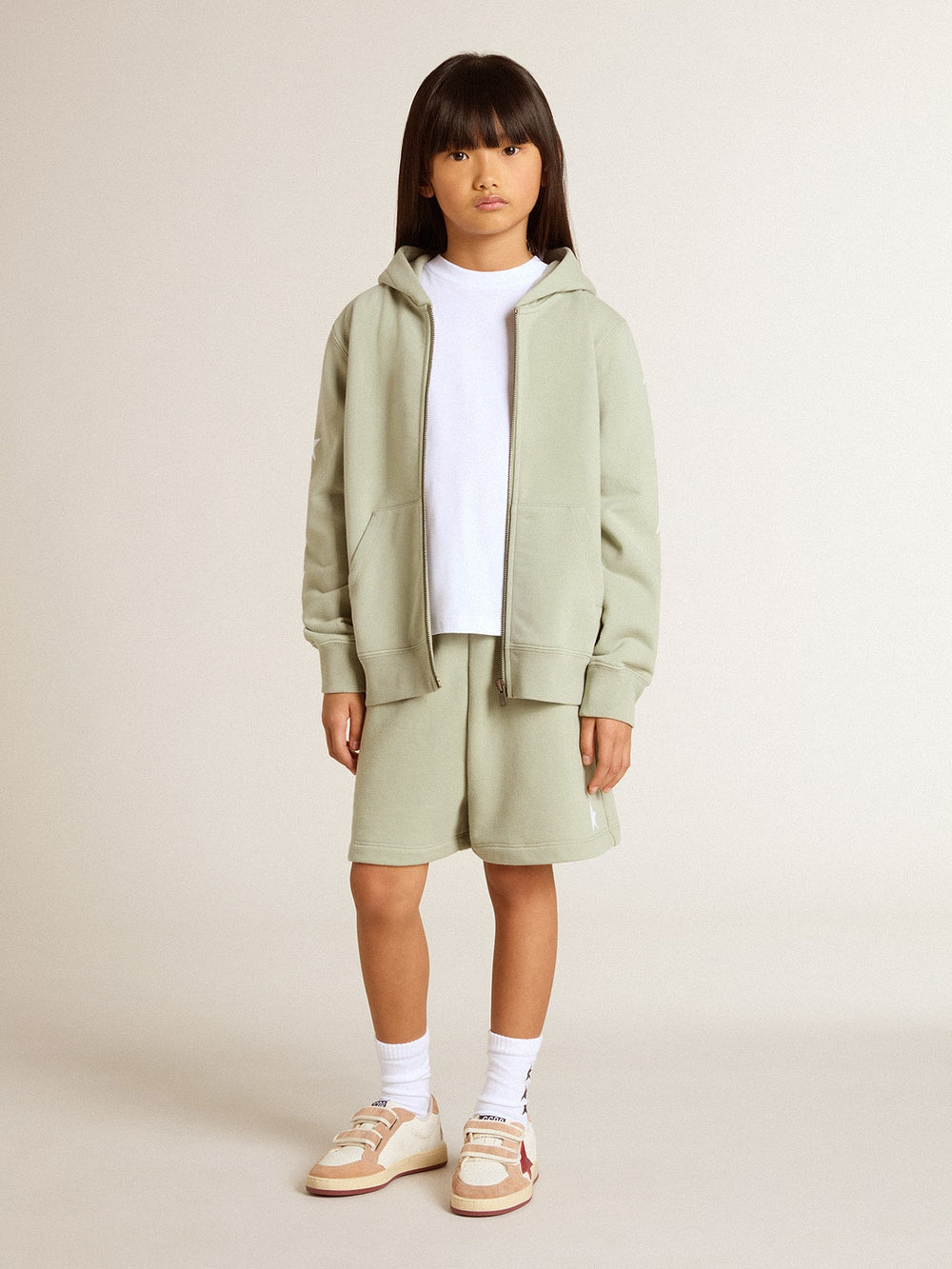 Light green sweatshirt with zip fastening
