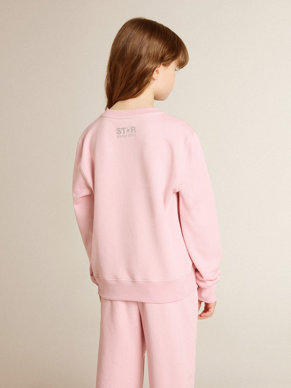 Pink sweatshirt with maxi star in silver glitter on the front