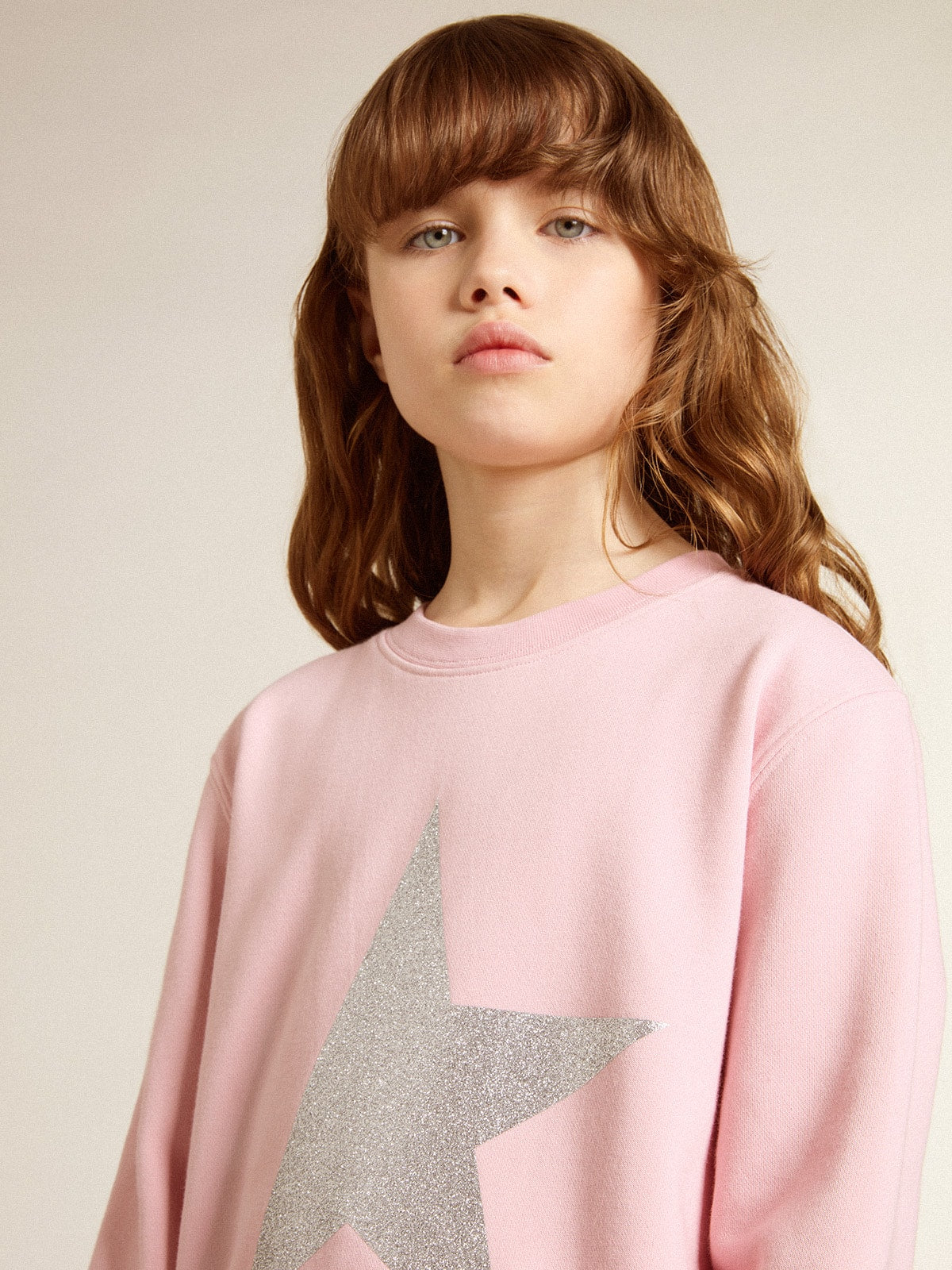 Pink sweatshirt with maxi star in silver glitter on the front