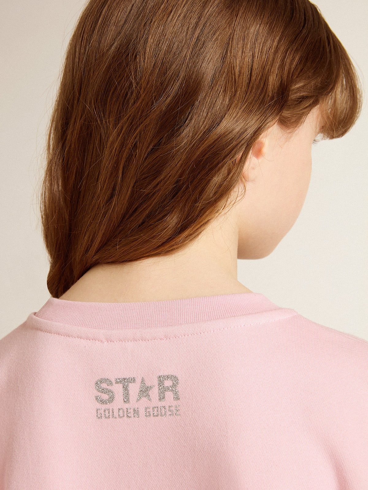 Pink sweatshirt with maxi star in silver glitter on the front