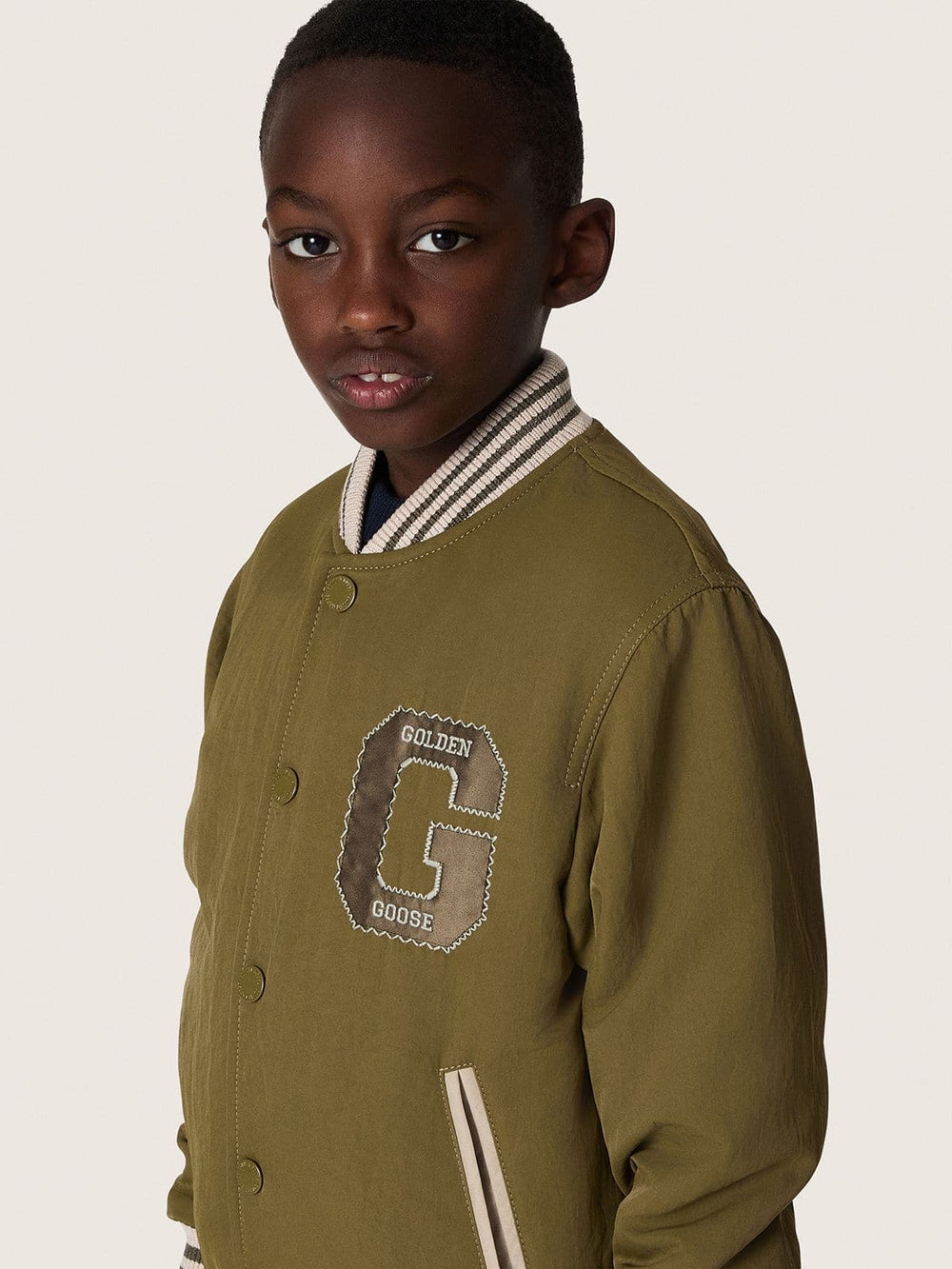 Journey unisex bomber jacket in military-green nylon twill with embroidered patch