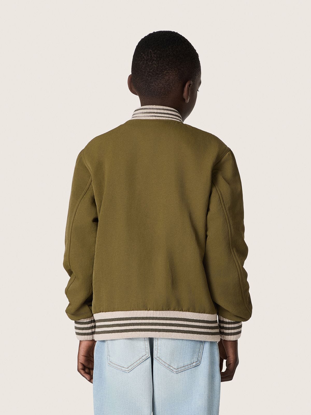 Journey unisex bomber jacket in military-green nylon twill with embroidered patch