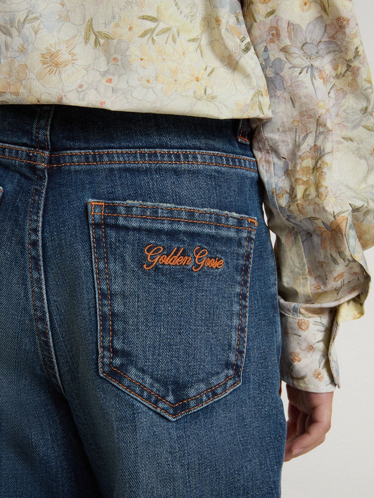 Girls' bootcut jeans with a medium wash and embroidery