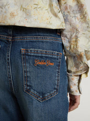Girls' bootcut jeans with a medium wash and embroidery