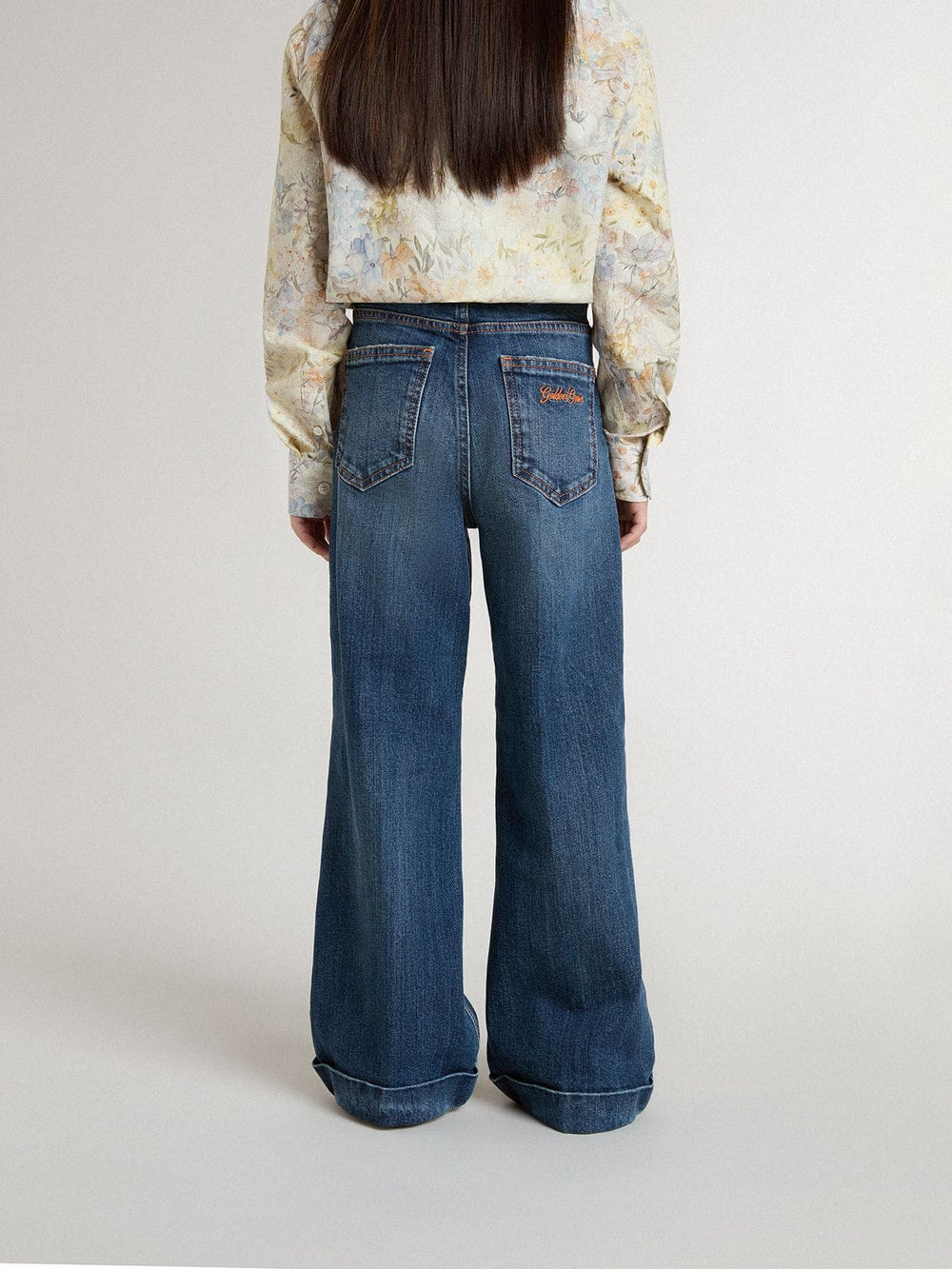 Girls' bootcut jeans with a medium wash and embroidery