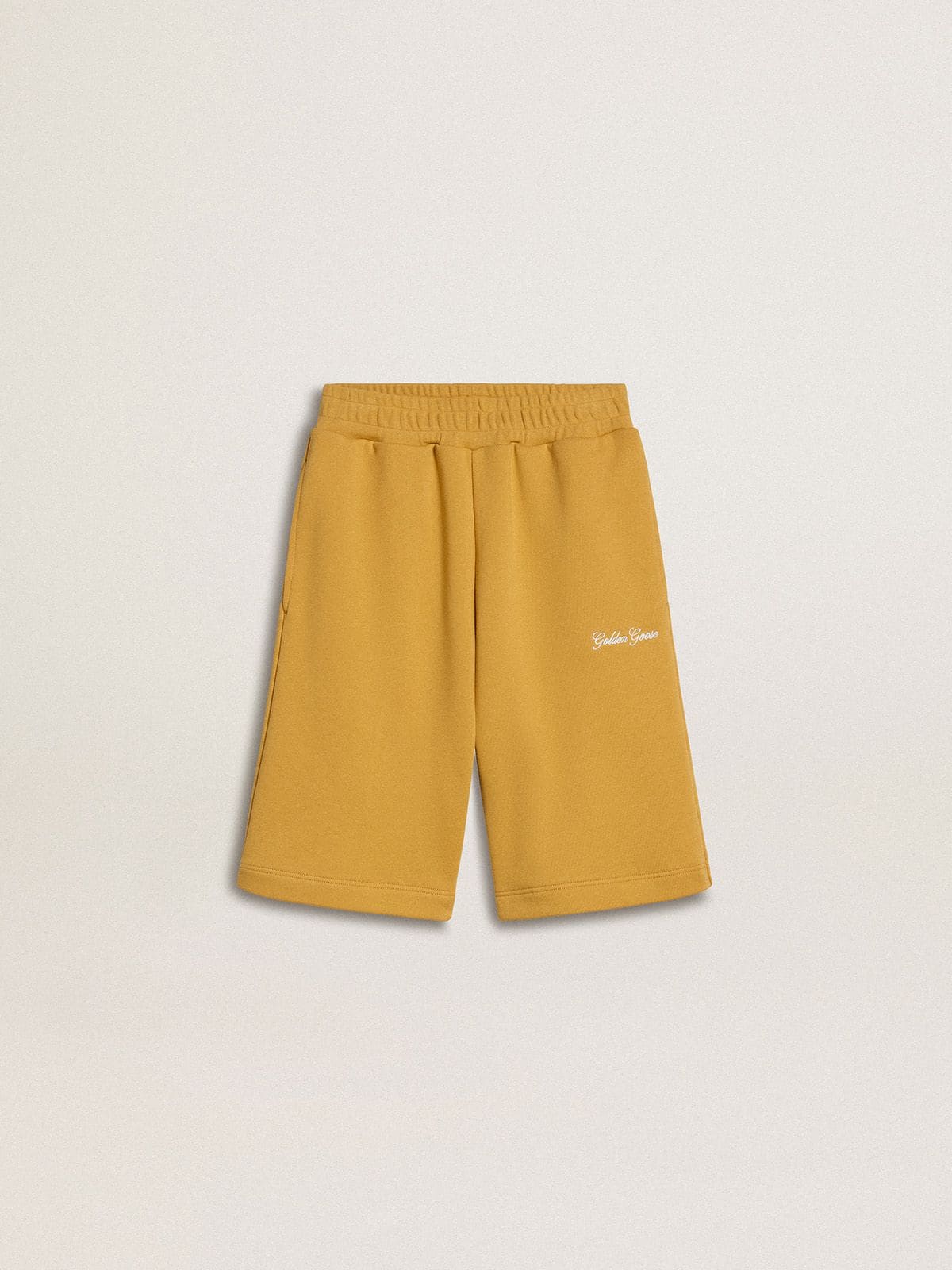 Kids jogging shorts in ochre yellow with embroidery