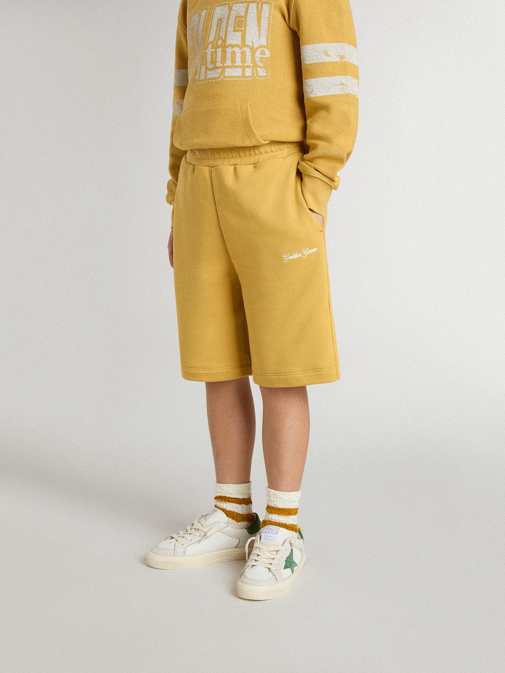 Kids jogging shorts in ochre yellow with embroidery