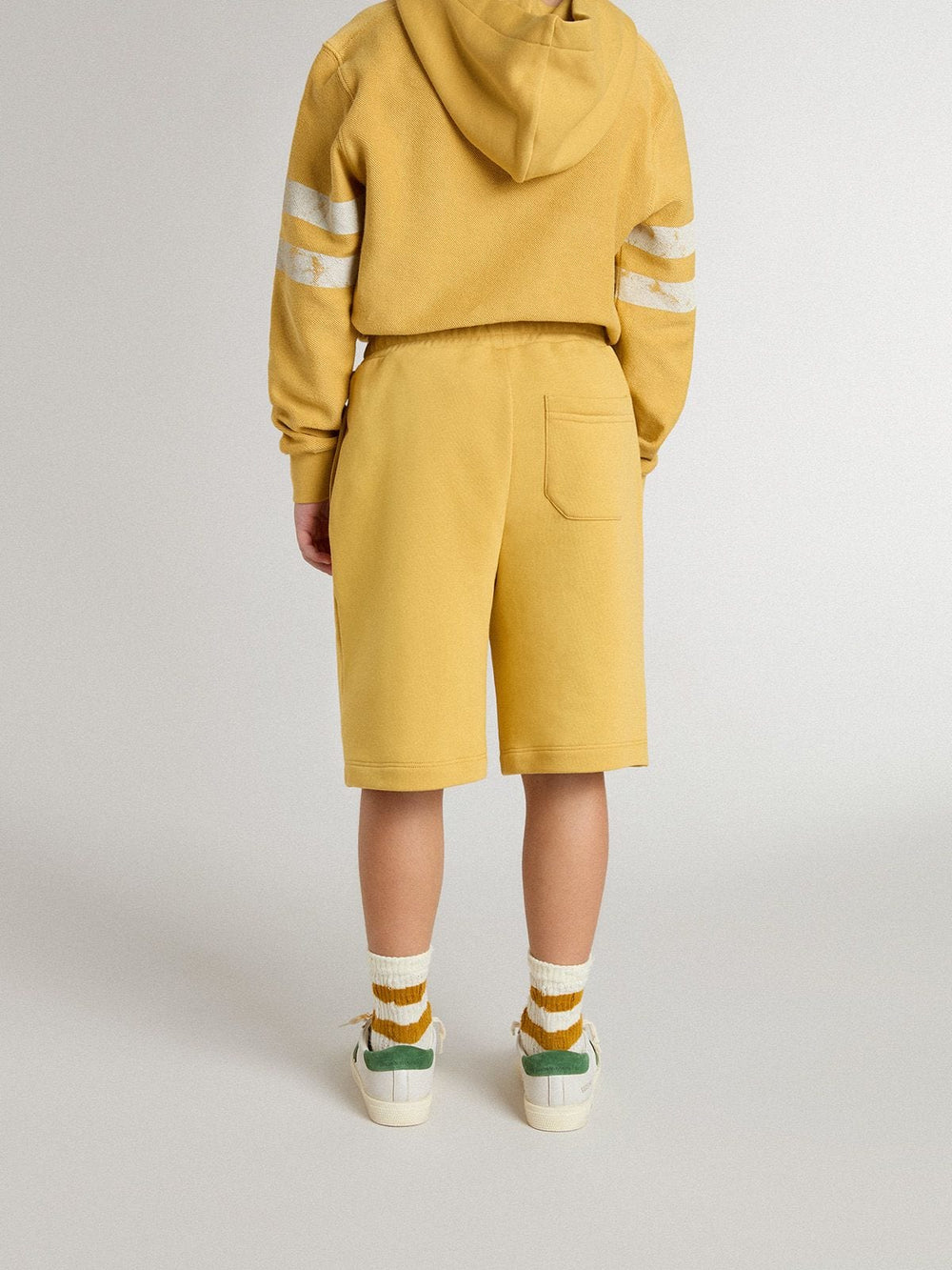 Kids jogging shorts in ochre yellow with embroidery