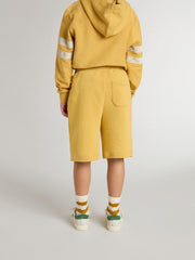 Kids jogging shorts in ochre yellow with embroidery