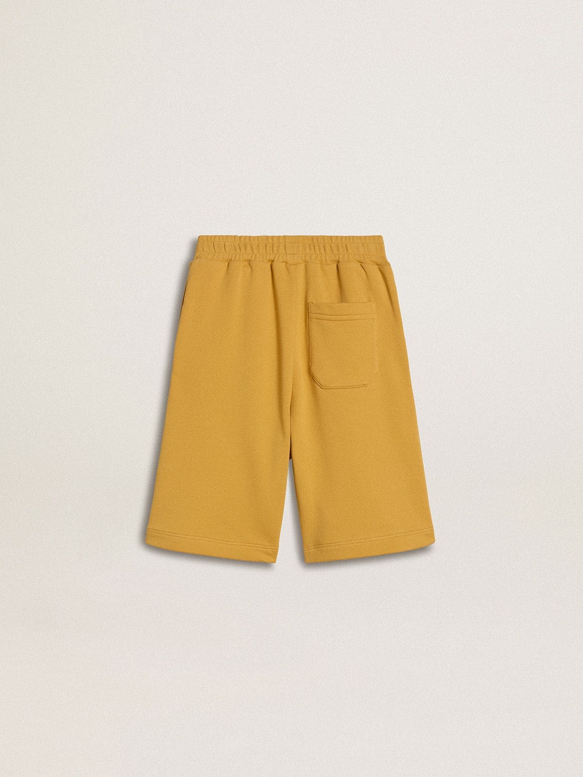 Kids jogging shorts in ochre yellow with embroidery