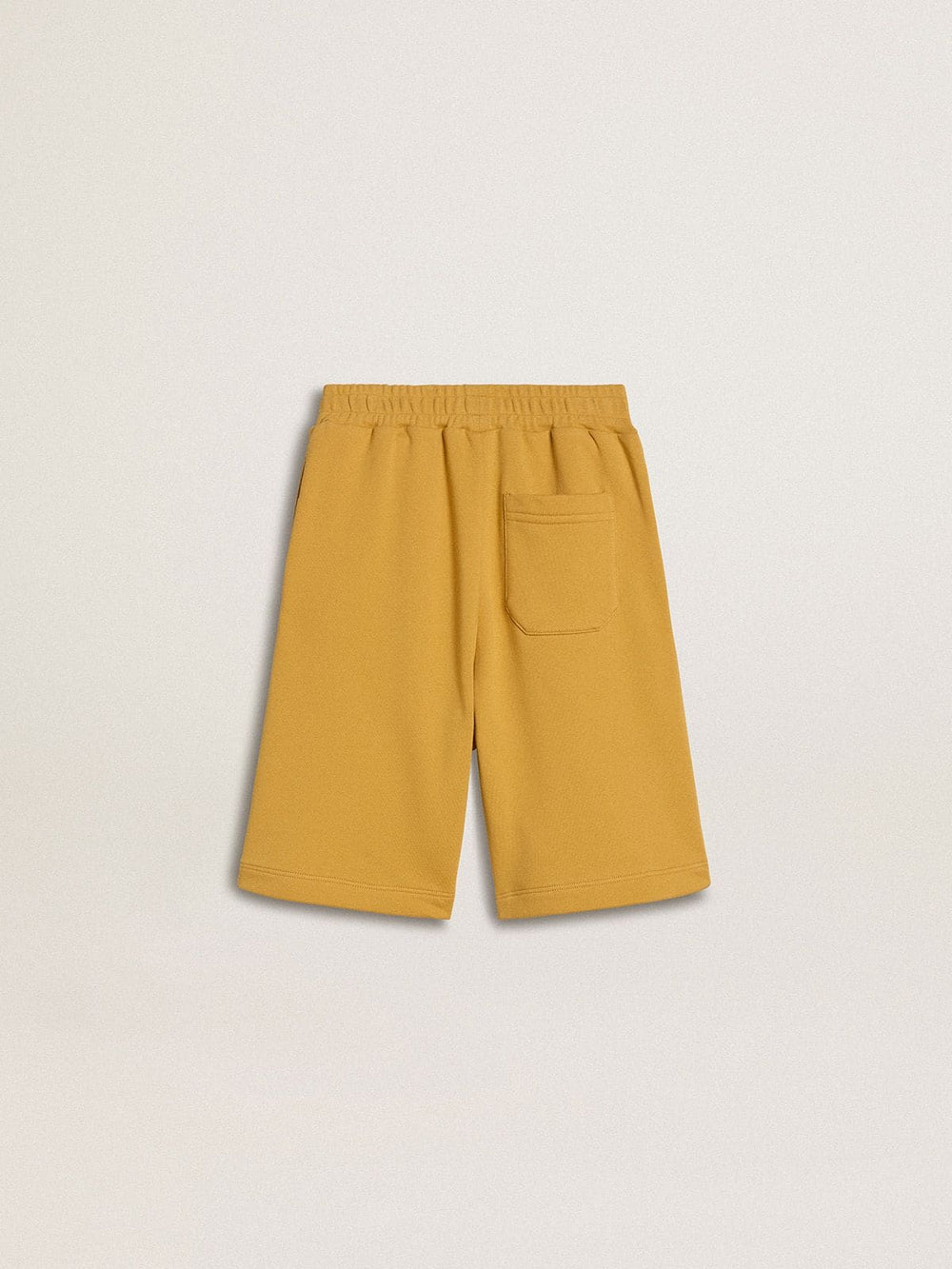 Kids jogging shorts in ochre yellow with embroidery