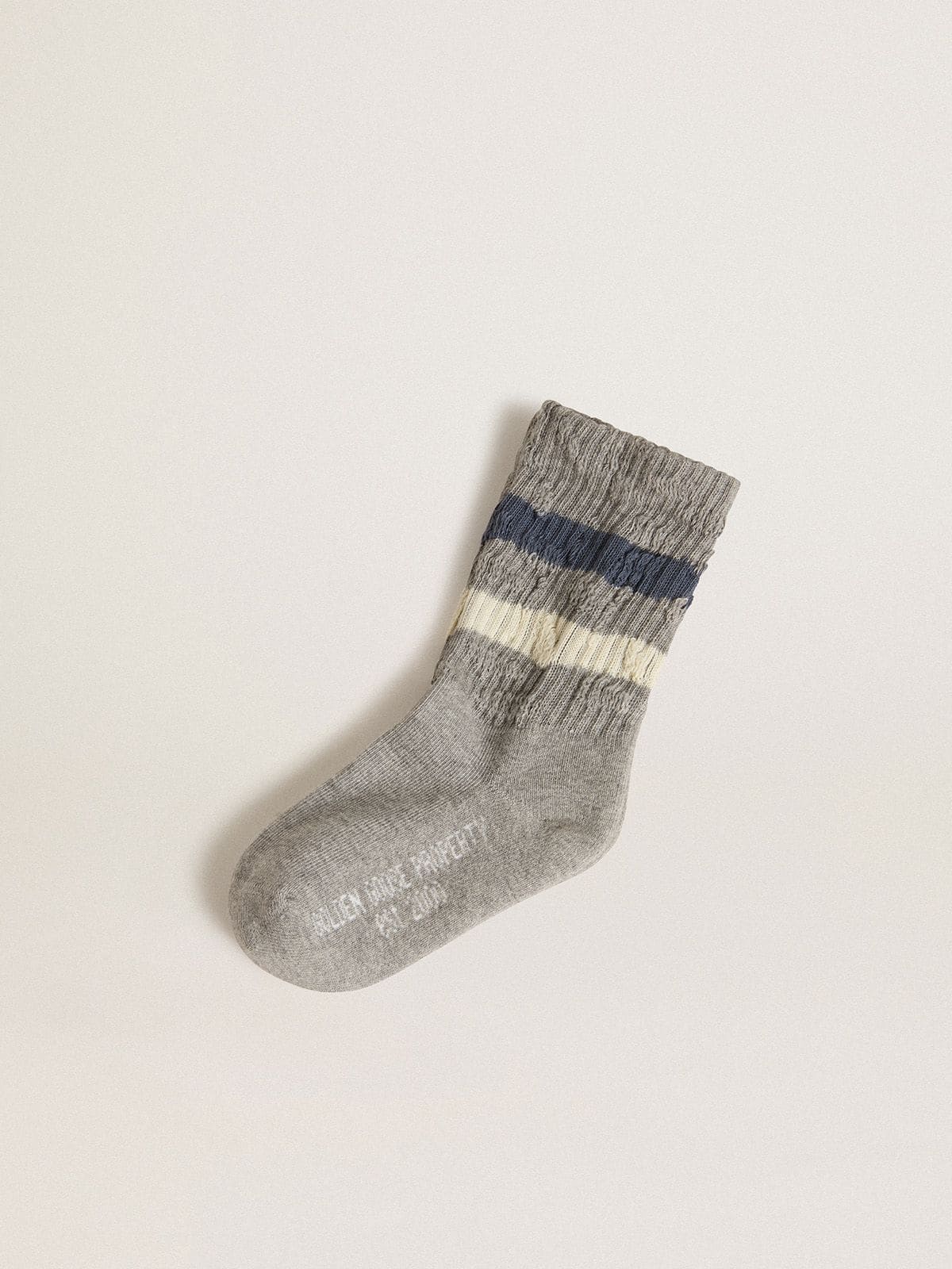 Kids’ gray socks with distressed details and worn-white and blue stripes