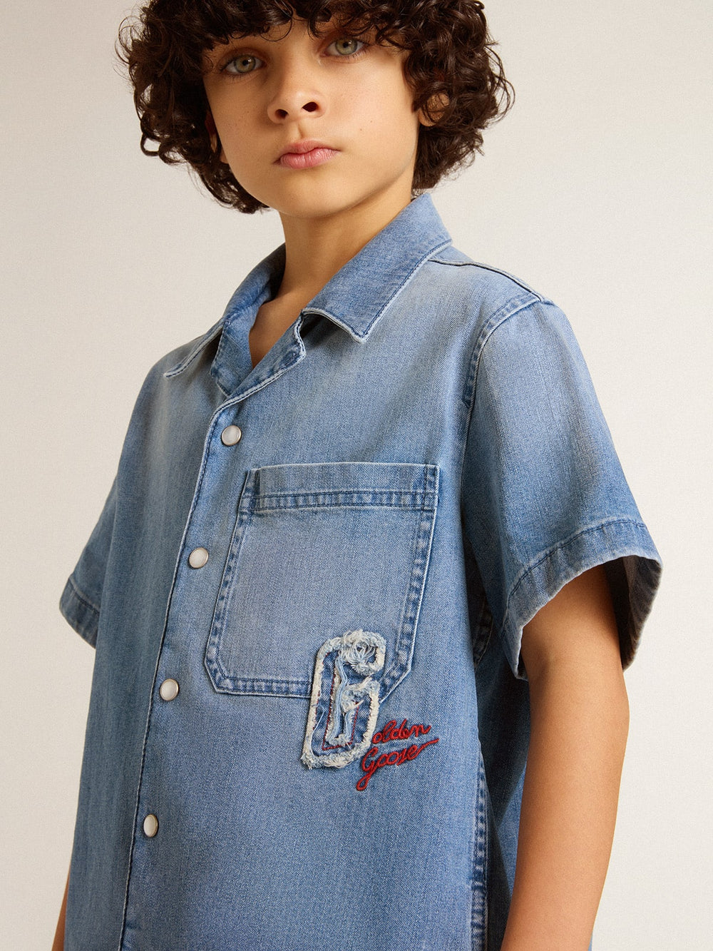 Kids’ denim shorts with embroidery on the back