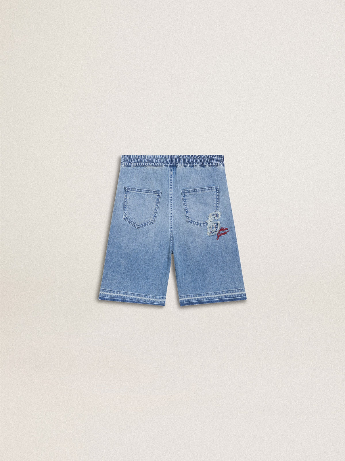 Kids’ denim shorts with embroidery on the back
