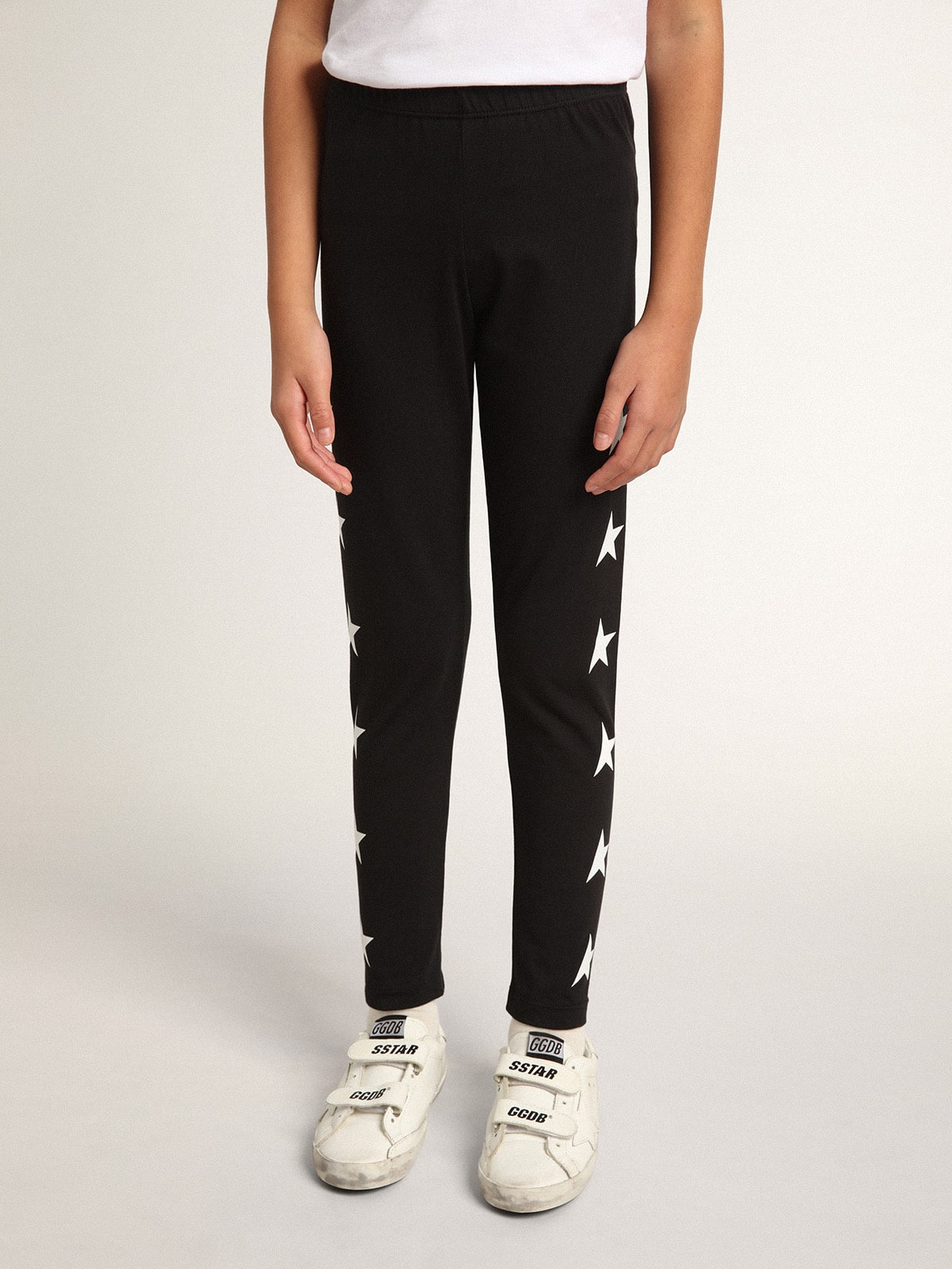 Girls’ black leggings with white stars on the sides