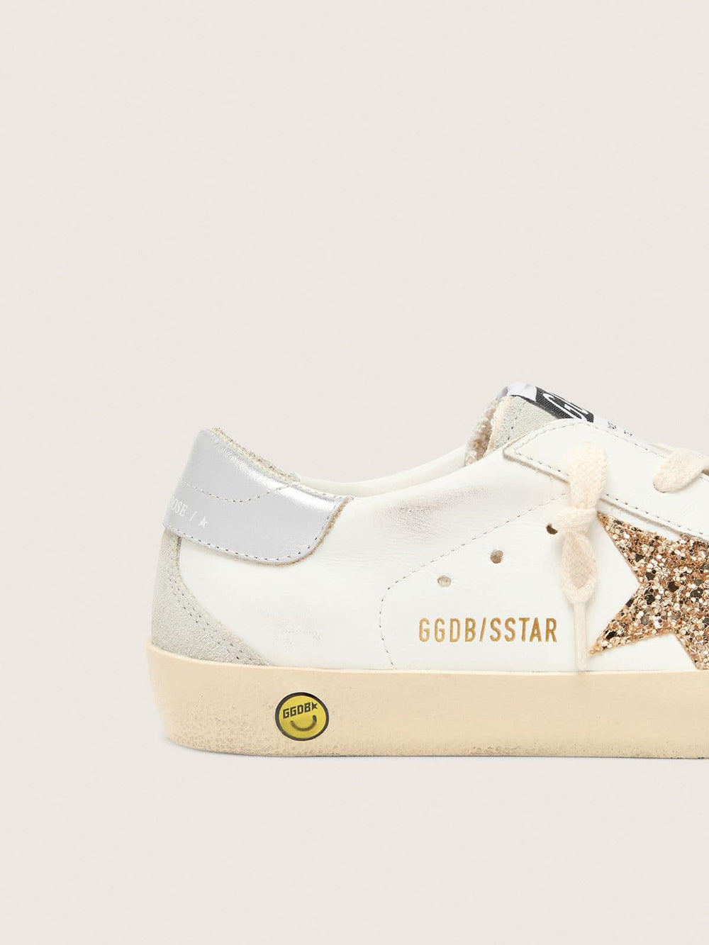 Junior Super-Star with gold glitter star and silver metallic leather heel tab
