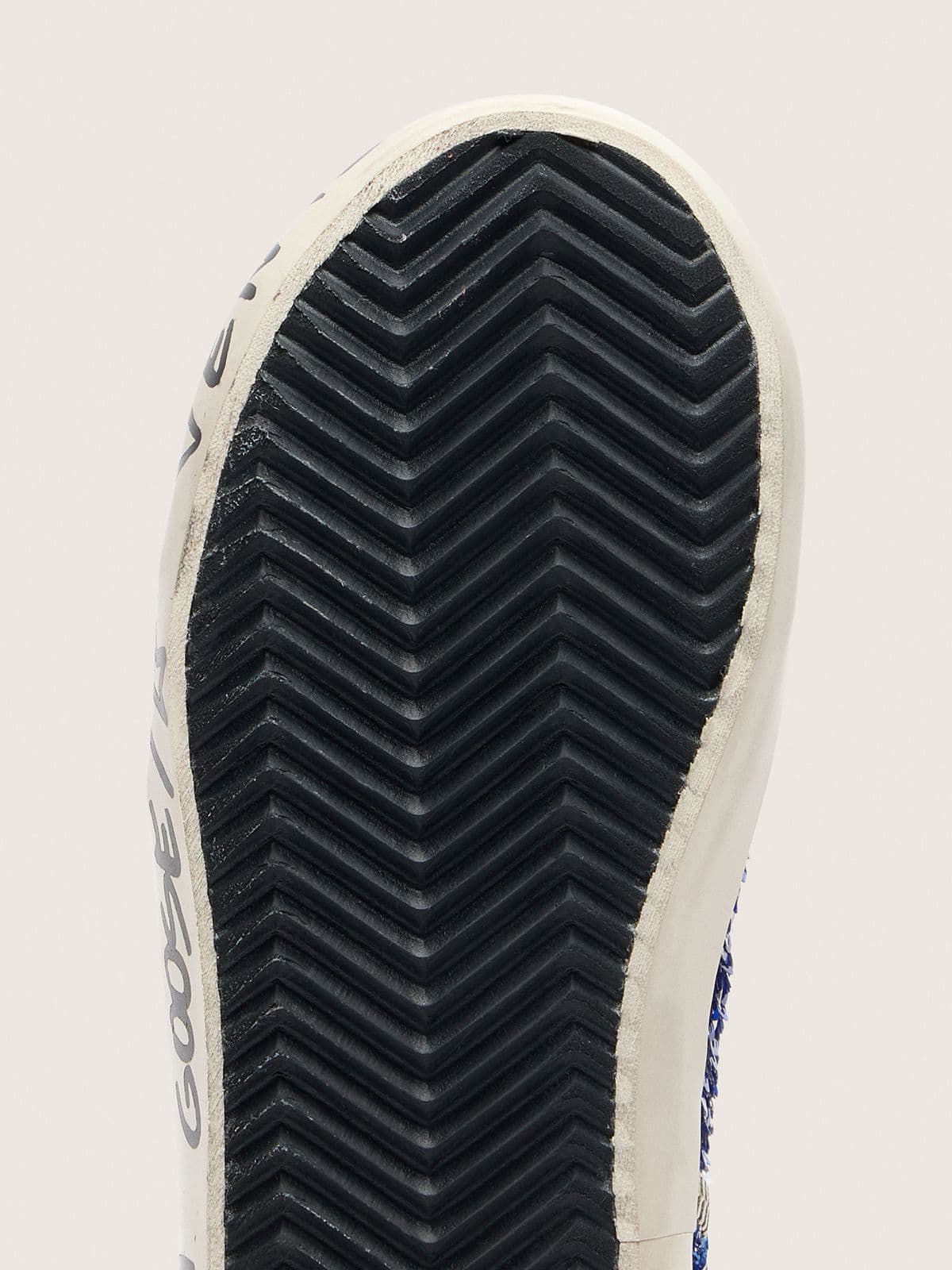 Junior Francy Penstar in blue sequins with white suede star