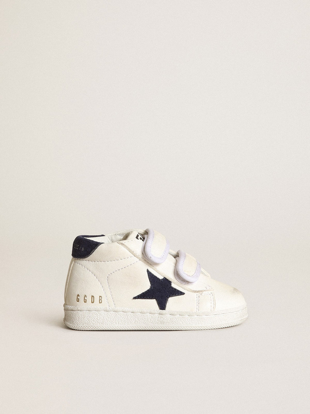 June Junior in nappa with dark blue suede star and heel tab