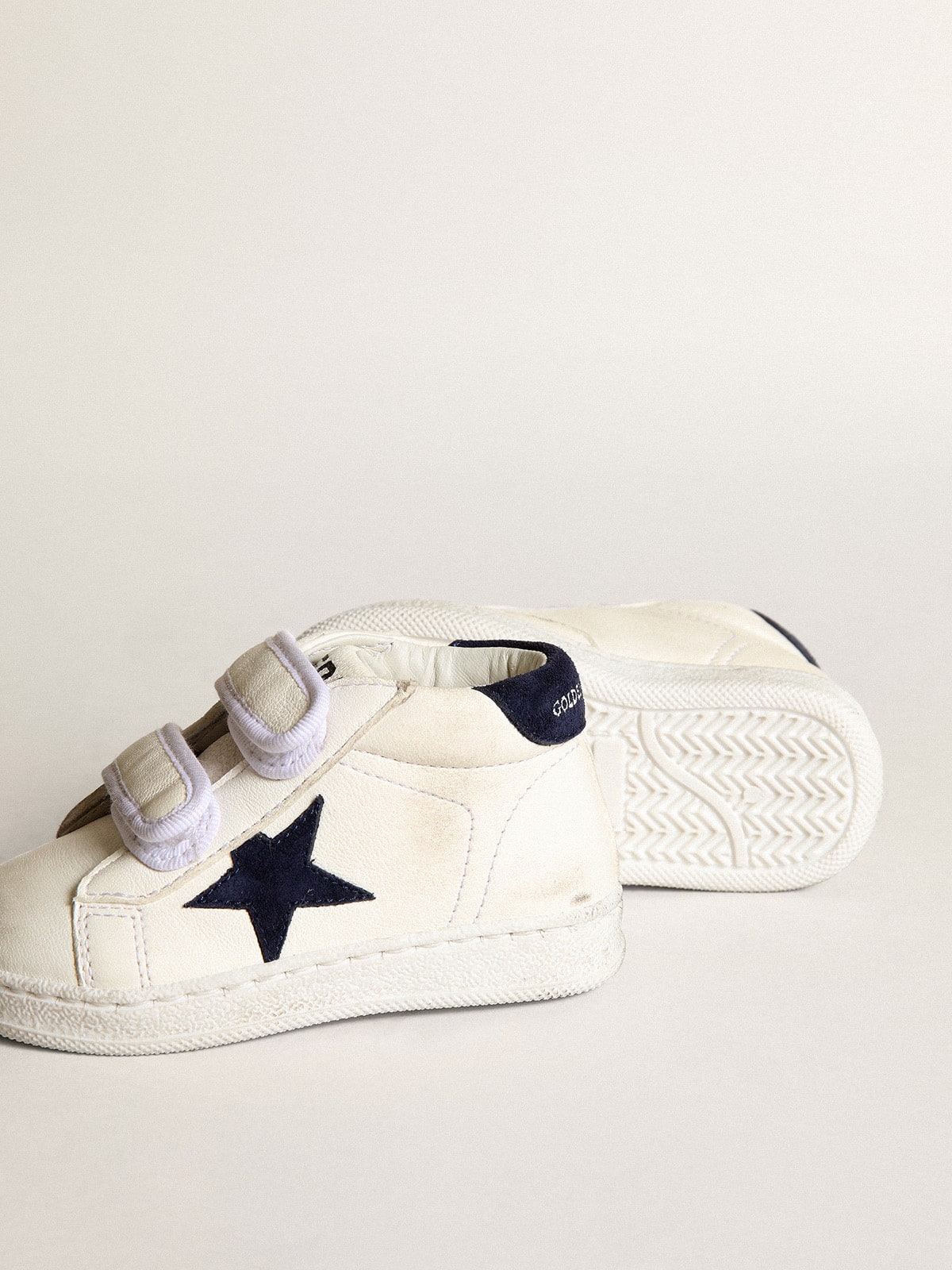 June Junior in nappa with dark blue suede star and heel tab