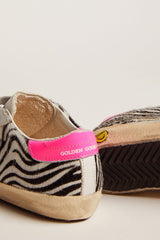 Junior Super-Star in leather and zebra-print pony skin with fuchsia heel tab