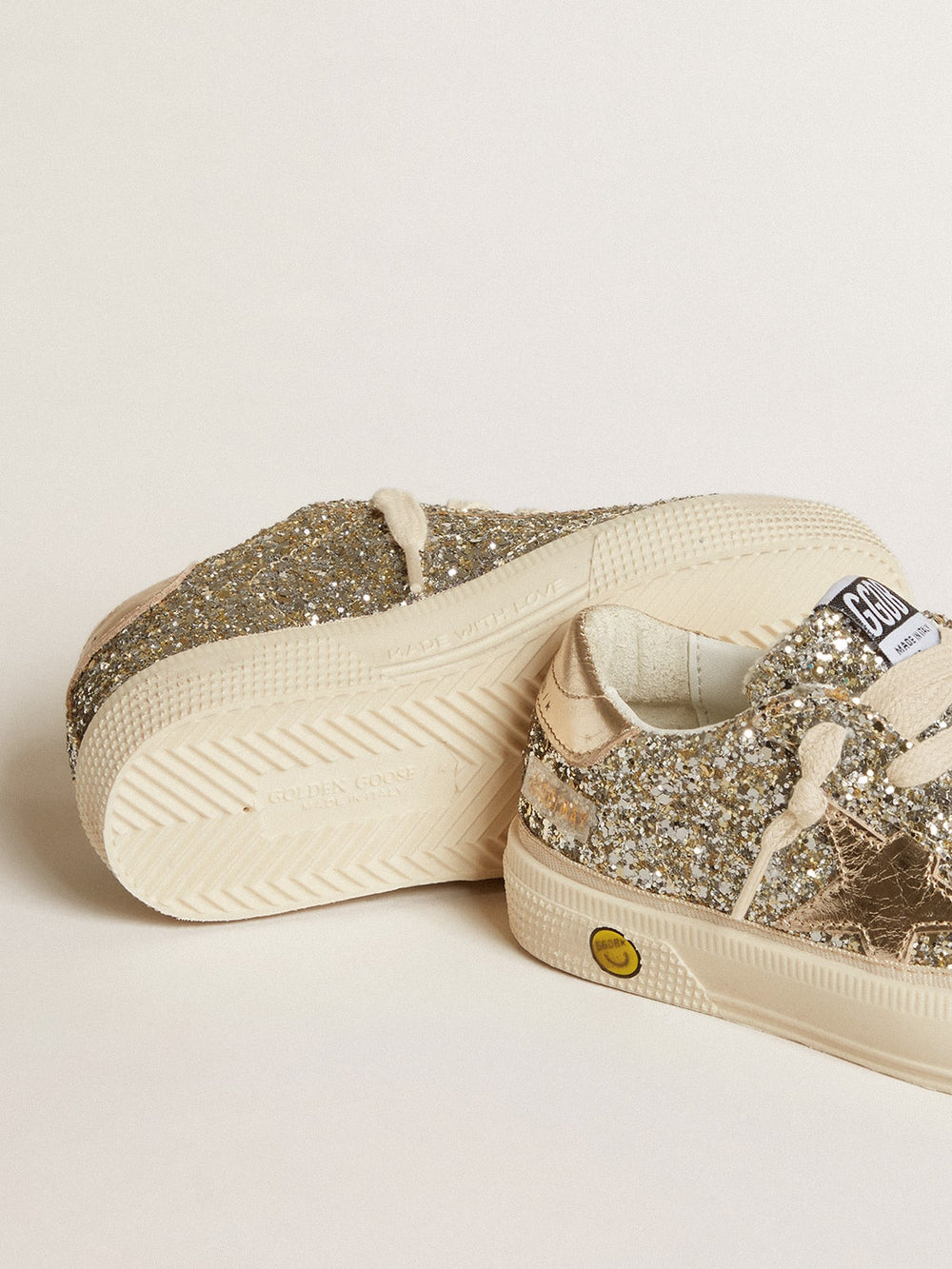 May Junior in platinum glitter with metallic leather star and heel tab
