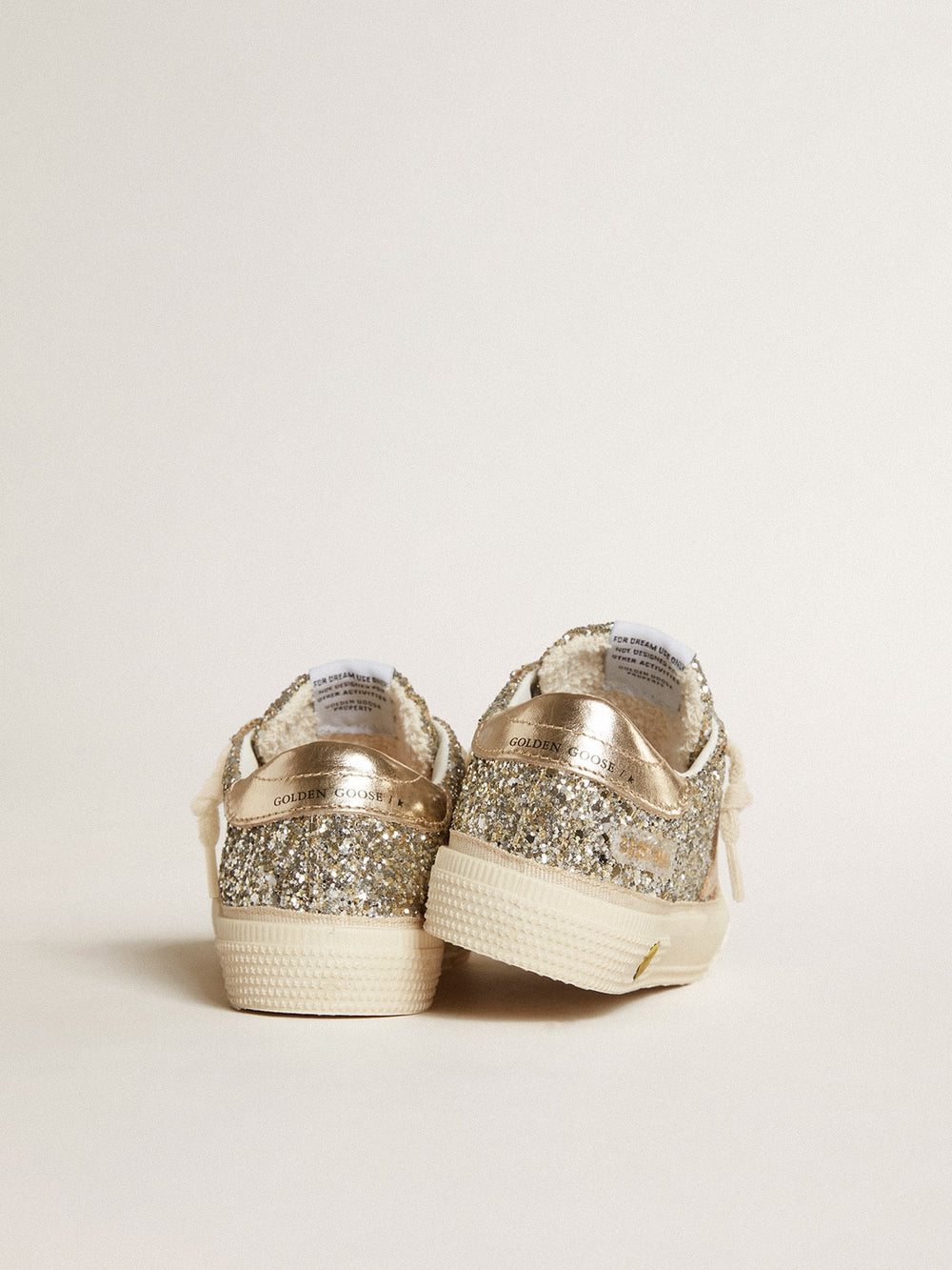 May Junior in platinum glitter with metallic leather star and heel tab