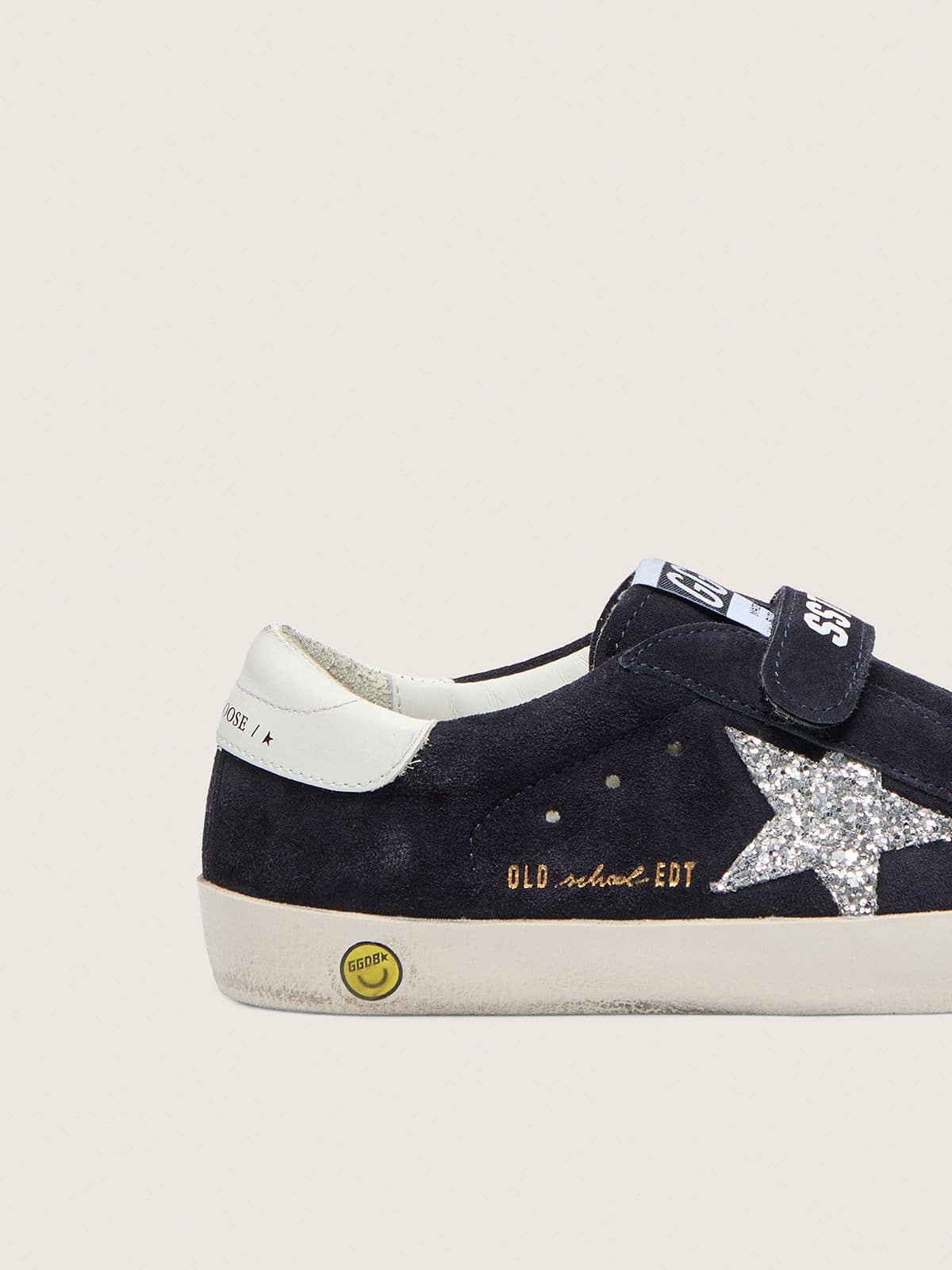 Junior Old School in blue suede with silver glitter star and white leather heel tab