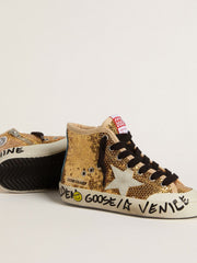Young Francy Penstar in gold sequins with ice-gray suede star